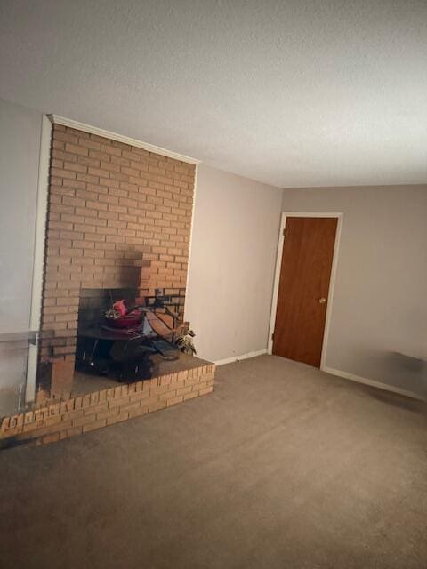 unfurnished living room featuring carpet floors, a fireplace, and a textured ceiling