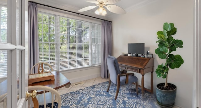 tiled home office featuring ornamental molding, ceiling fan, plenty of natural light, and baseboards
