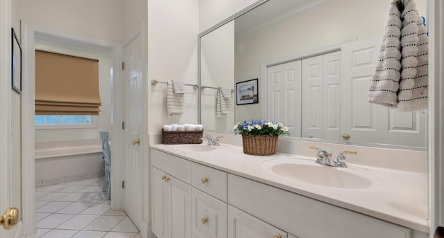 bathroom featuring tile patterned floors, double vanity, and a sink