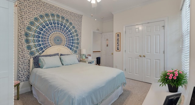 bedroom with light carpet, a closet, and ornamental molding