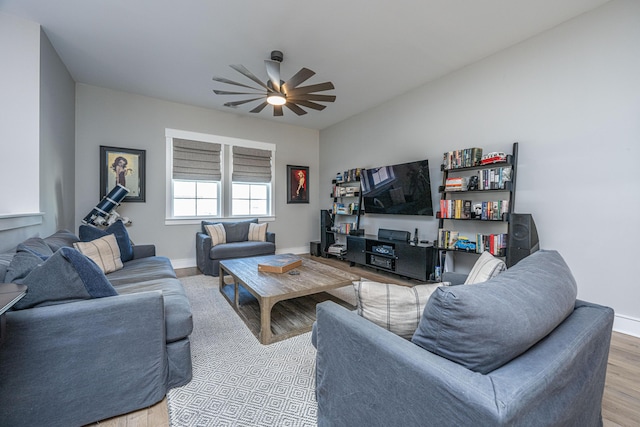 living room featuring ceiling fan and light wood-type flooring