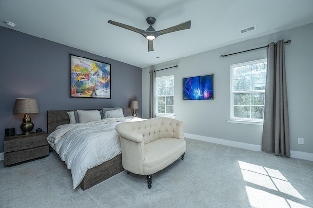 bedroom with light colored carpet and ceiling fan