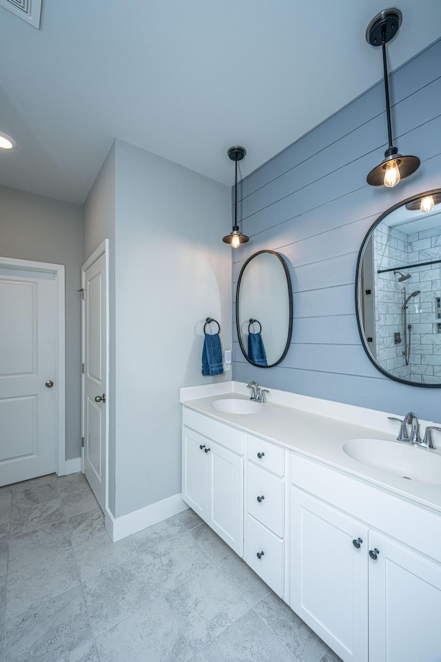 bathroom featuring vanity and a shower