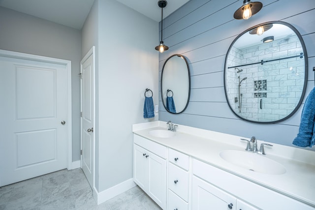 bathroom featuring walk in shower and vanity