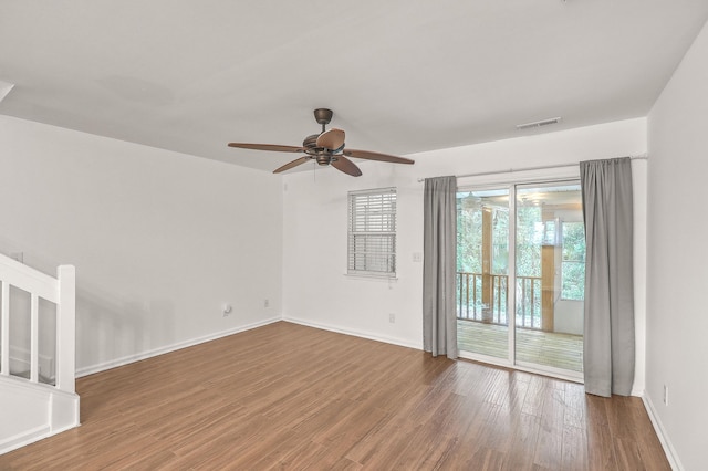 spare room featuring hardwood / wood-style floors and ceiling fan