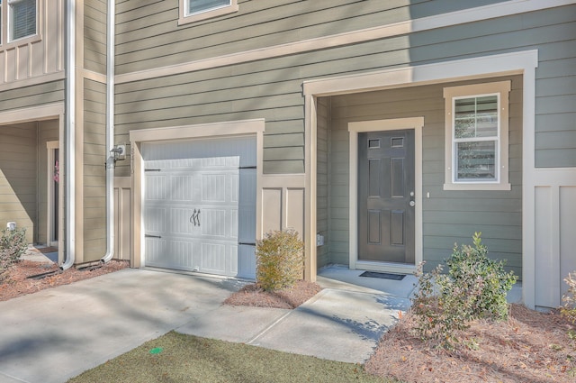 view of exterior entry featuring a garage