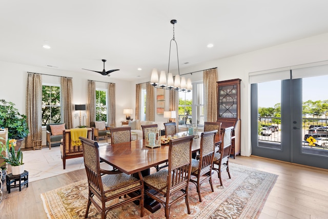 dining space featuring ceiling fan and light hardwood / wood-style flooring