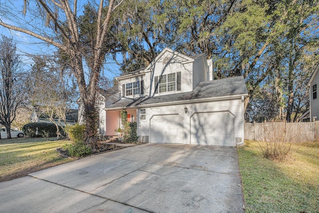 front facade with a garage and a front lawn