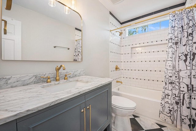 full bathroom featuring vanity, shower / bath combination with curtain, and toilet