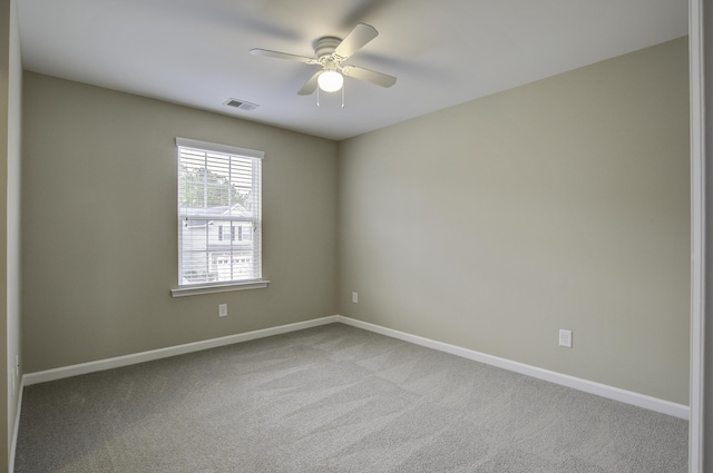 carpeted empty room with ceiling fan