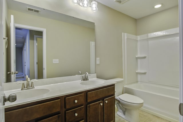 full bathroom with shower / bath combination, tile patterned flooring, vanity, and toilet