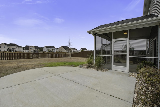 view of patio / terrace with a sunroom