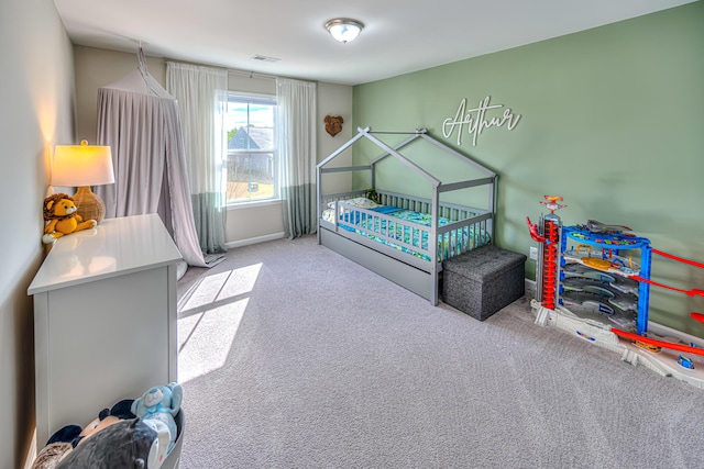 carpeted bedroom with visible vents