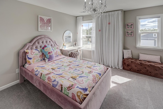 bedroom with visible vents, baseboards, an inviting chandelier, and carpet flooring