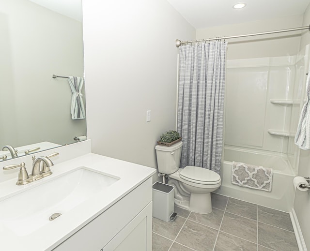 bathroom with vanity, tile patterned floors, toilet, and shower / bath combo with shower curtain