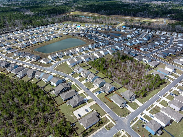 aerial view with a residential view and a water view