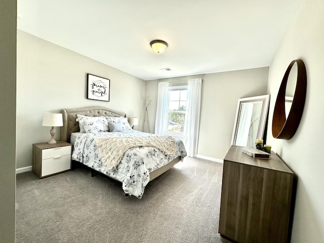 carpeted bedroom featuring visible vents and baseboards