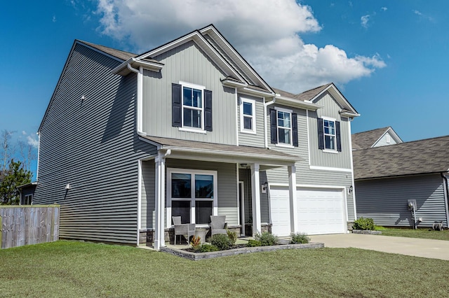 view of front of property with driveway, a porch, fence, a front yard, and an attached garage