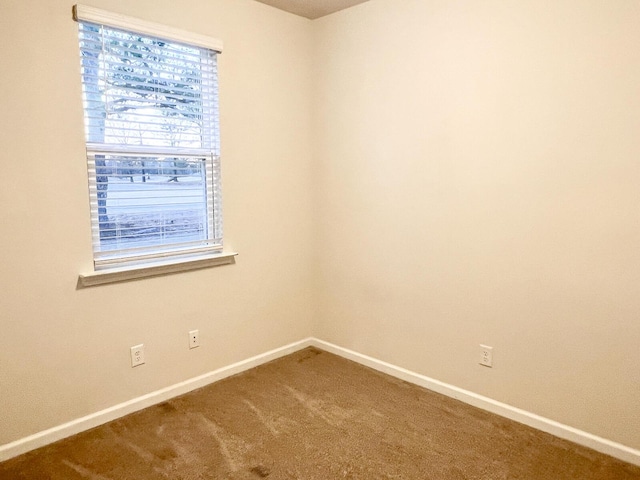 empty room featuring carpet flooring