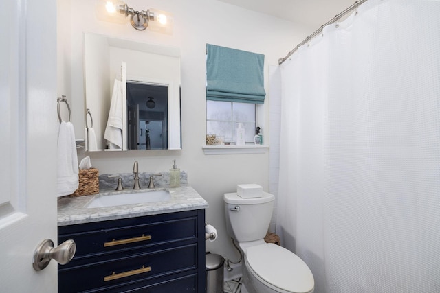 bathroom with vanity and toilet
