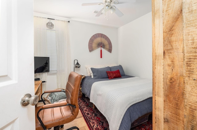 bedroom featuring ceiling fan and hardwood / wood-style floors