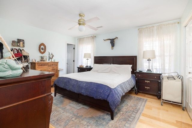 bedroom featuring ceiling fan and light hardwood / wood-style floors