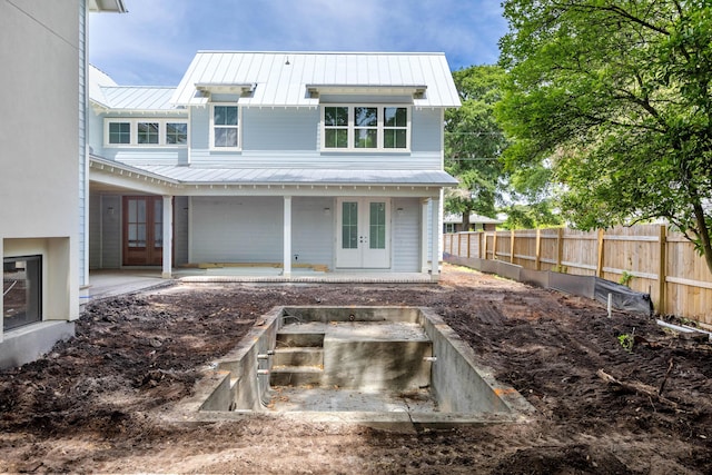 931 Kincade Dr, Mount Pleasant, SC 29464 - back of property featuring french doors, metal roof, and a standing seam roof