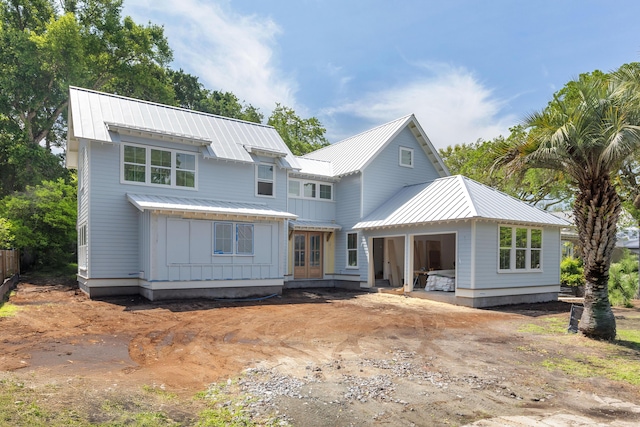931 Kincade Dr, Mount Pleasant, SC 29464 - modern farmhouse style home featuring board and batten siding, metal roof, and french doors