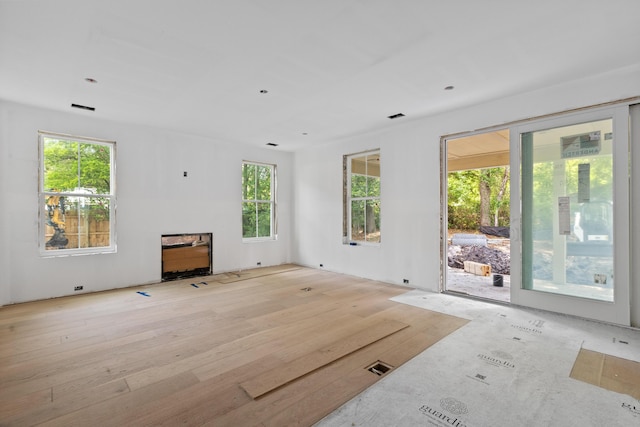 931 Kincade Dr, Mount Pleasant, SC 29464 - unfurnished living room featuring wood finished floors and a fireplace