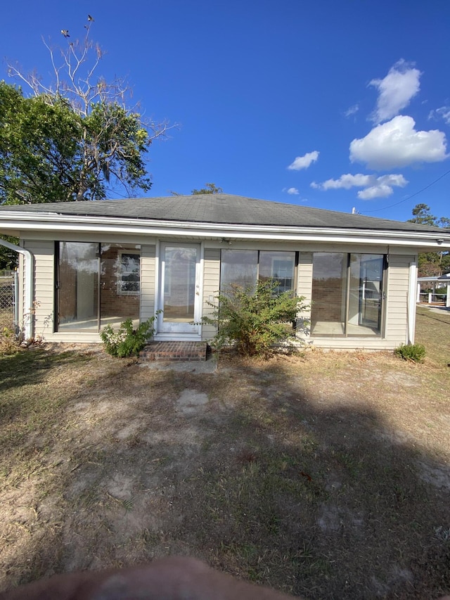 rear view of property featuring a patio