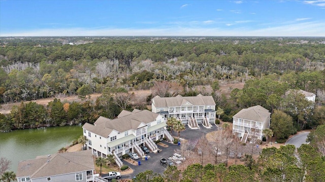 aerial view with a water view and a view of trees