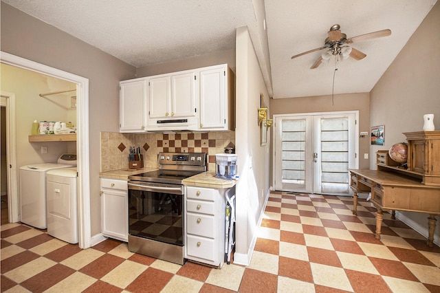 kitchen with stainless steel electric range oven, light floors, washer and dryer, under cabinet range hood, and white cabinets