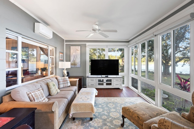 sunroom featuring a wall mounted AC, a healthy amount of sunlight, tile patterned floors, and crown molding