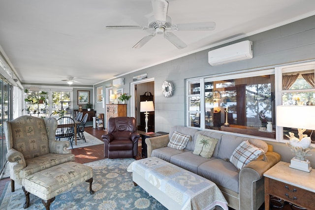 living room featuring a wall mounted air conditioner, a ceiling fan, ornamental molding, and wood finished floors