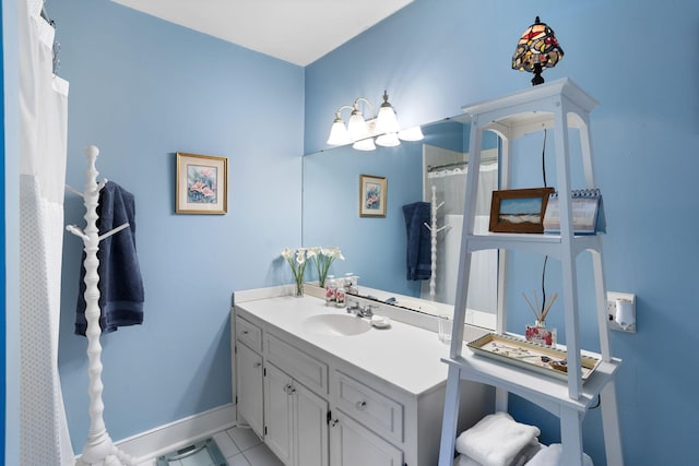 full bathroom featuring baseboards and vanity