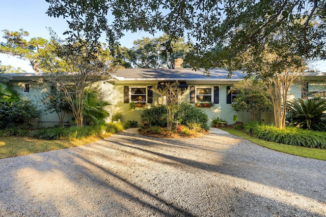 ranch-style house with a chimney