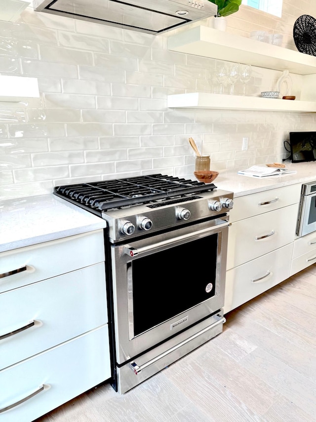 30 Nats Ct, Charleston, SC 29403 - kitchen featuring high end stove, tasteful backsplash, light countertops, and white cabinets
