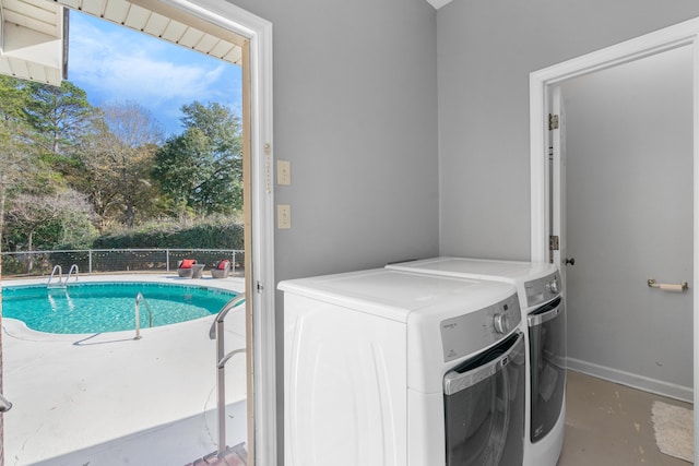 laundry area with a healthy amount of sunlight and separate washer and dryer