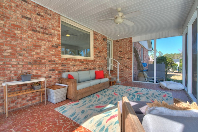 sunroom / solarium featuring ceiling fan