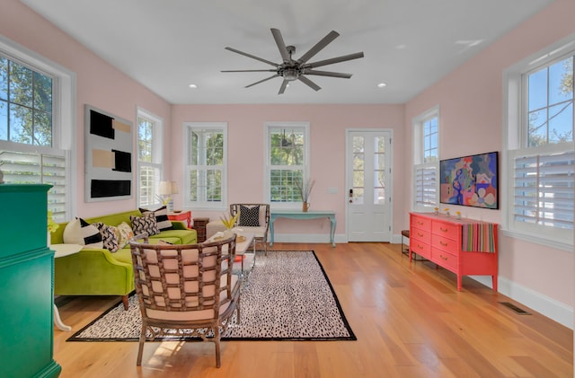 living room featuring light hardwood / wood-style flooring and plenty of natural light