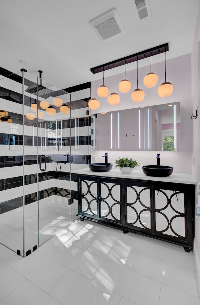 kitchen featuring pendant lighting and light tile patterned floors