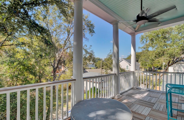 wooden terrace featuring ceiling fan