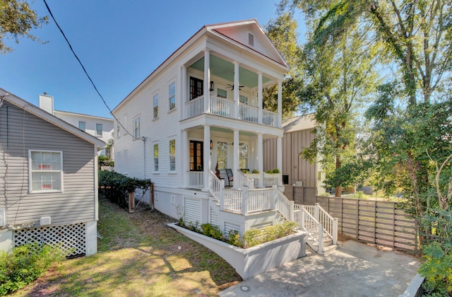 view of front of house featuring a porch and a balcony