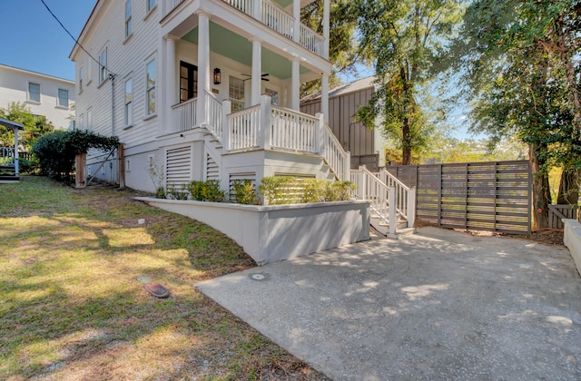 view of front of home featuring covered porch and a balcony