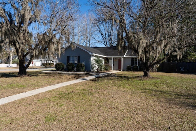 ranch-style house featuring a front yard