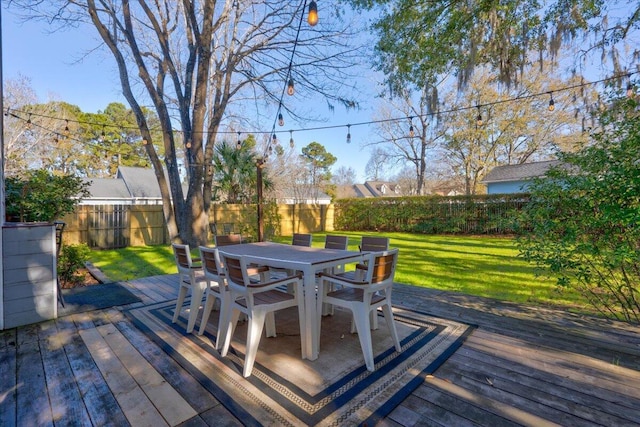 wooden terrace featuring a yard