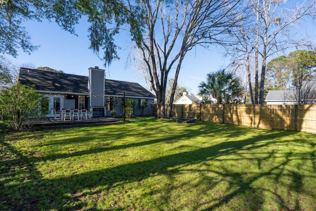 view of yard featuring a wooden deck