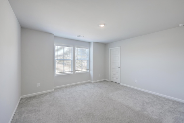 empty room with light colored carpet