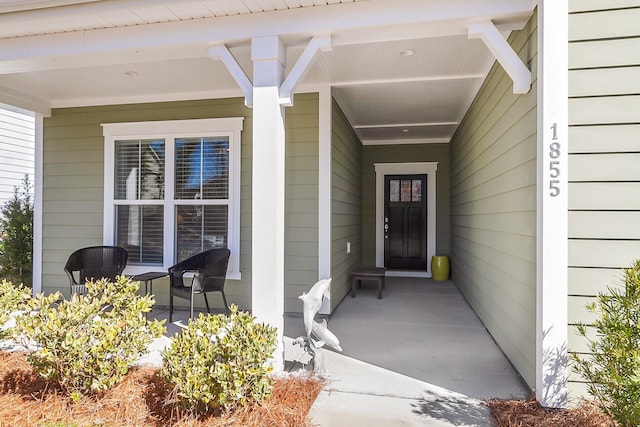 property entrance featuring a porch