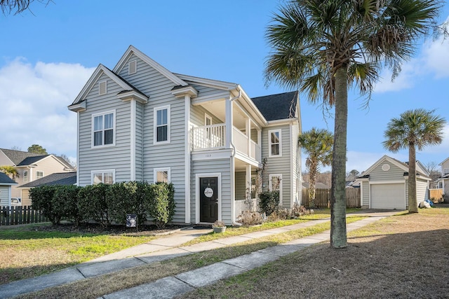 view of front of home featuring an outdoor structure, fence, and a balcony